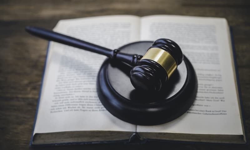 Law theme, mallet of the judge, law enforcement officers, evidence-based cases and documents taken into account..
