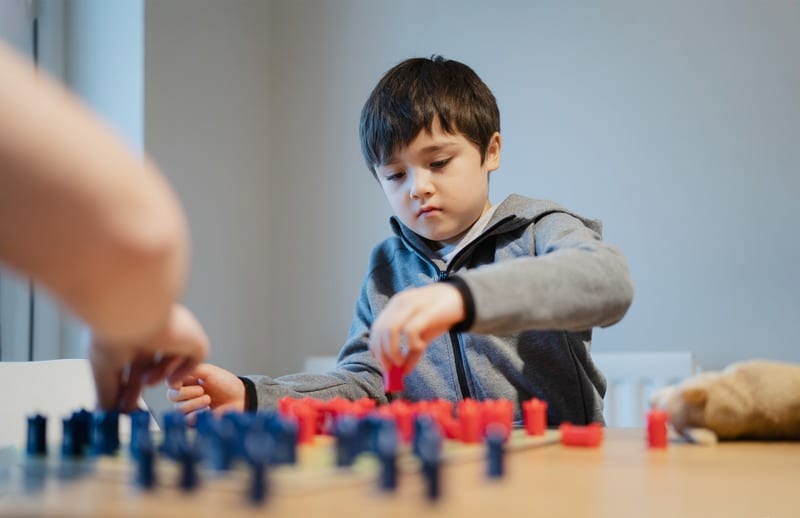 child playing board game