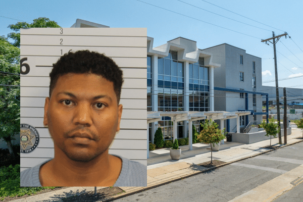 Image of Kenya White, the former teacher who has agreed to plead guilty to a federal charge of child enticement, shown with Chattanooga Preparatory School in the background.