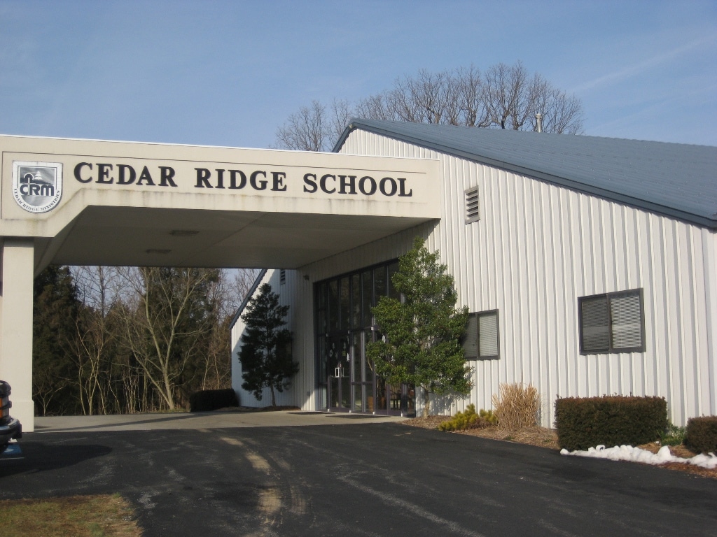 Exterior view of Cedar Ridge School, a facility named in a civil lawsuit alleging institutional failure to protect a child from sexual abuse by former staff member Joey Ericson.