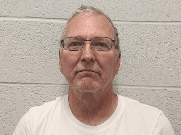 Mugshot of Dr. Christopher Davis, who is facing 92 criminal counts, including rape and sexual extortion.