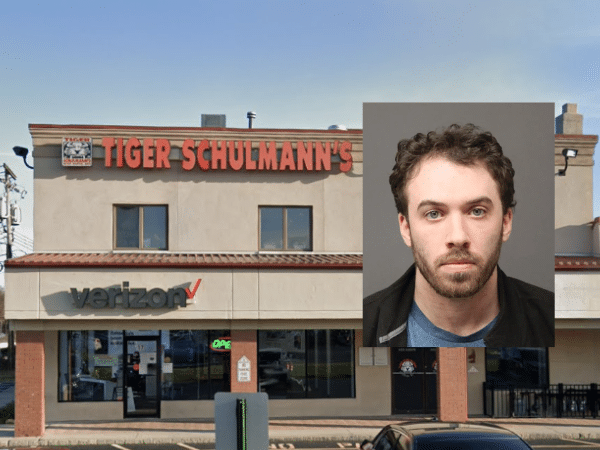 Exterior of Tiger Schulmann’s Martial Arts studio in Ramsey, New Jersey, with an inset booking photo of Ryan J. Curtin, a former employee accused of secretly recording multiple victims, including children, in the restroom.
