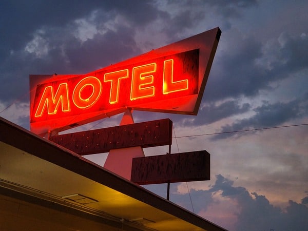 Red Neon Sign Outside Motel