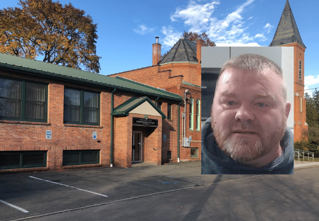Athens Area School District building in Pennsylvania with image of former employee Jason Lavern Isbell, a convicted sex offender. The District has been named in a federal sexual abuse lawsuit.